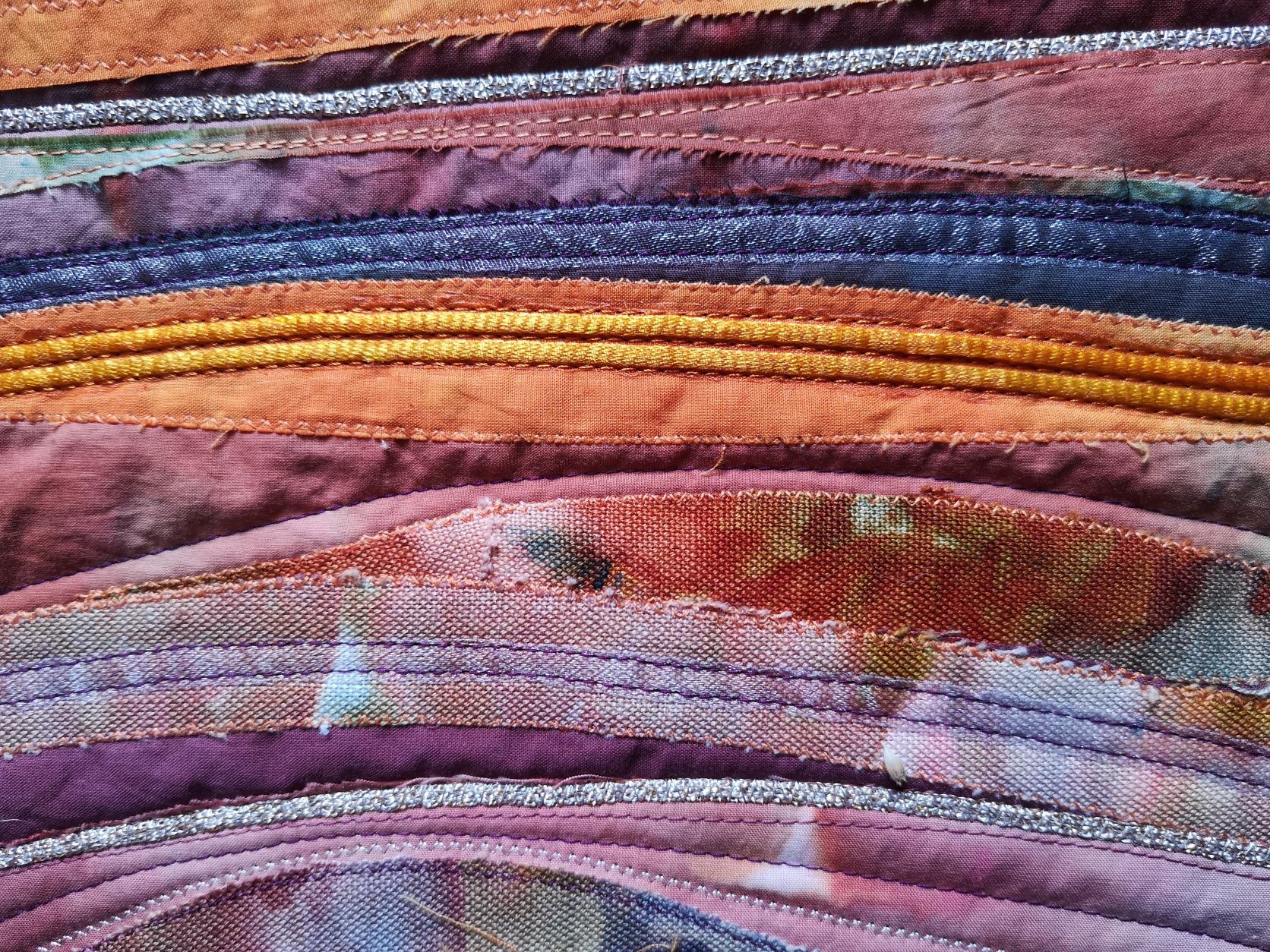 Textile landscape with warm sunset colours