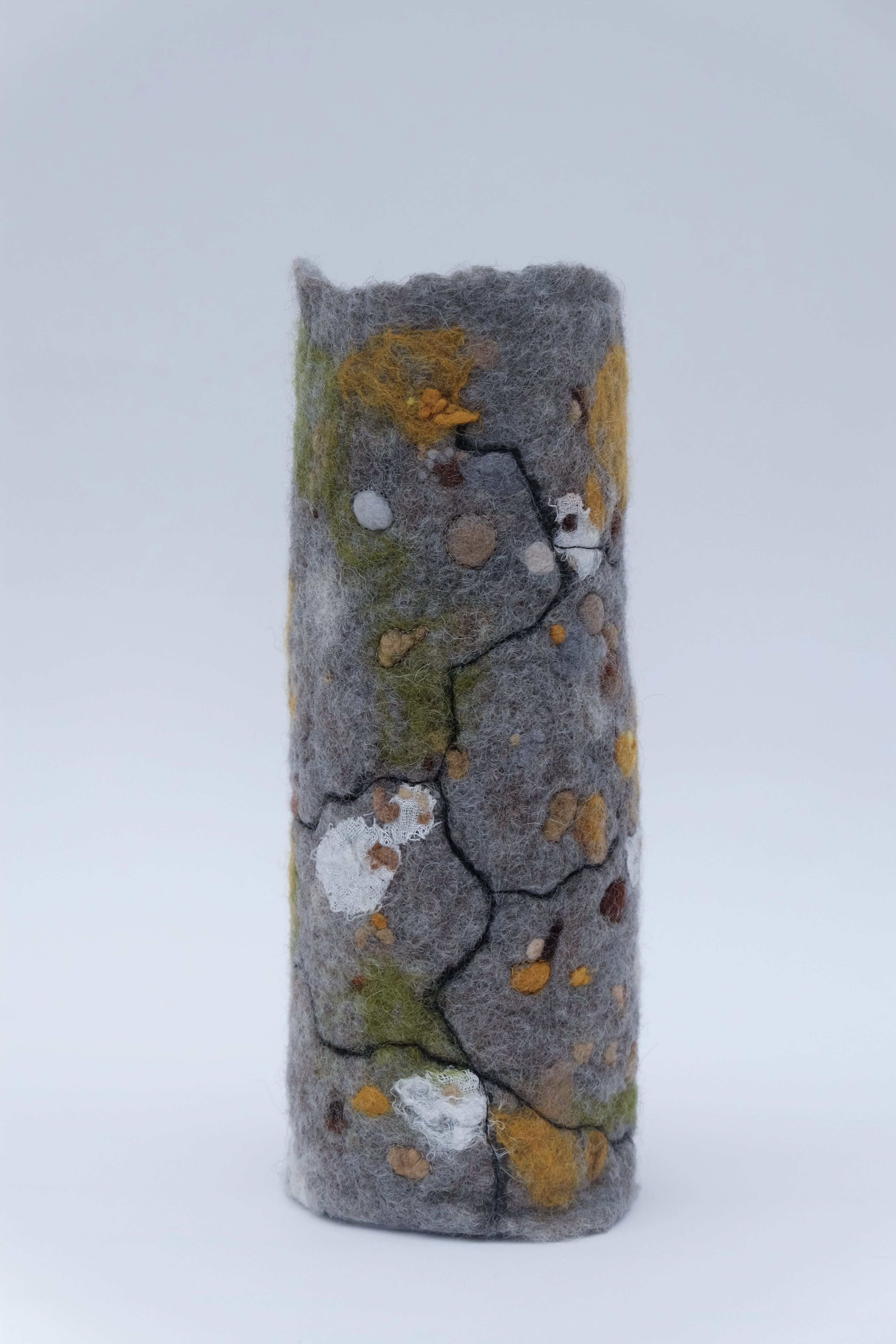 Gray felted vessel with texture