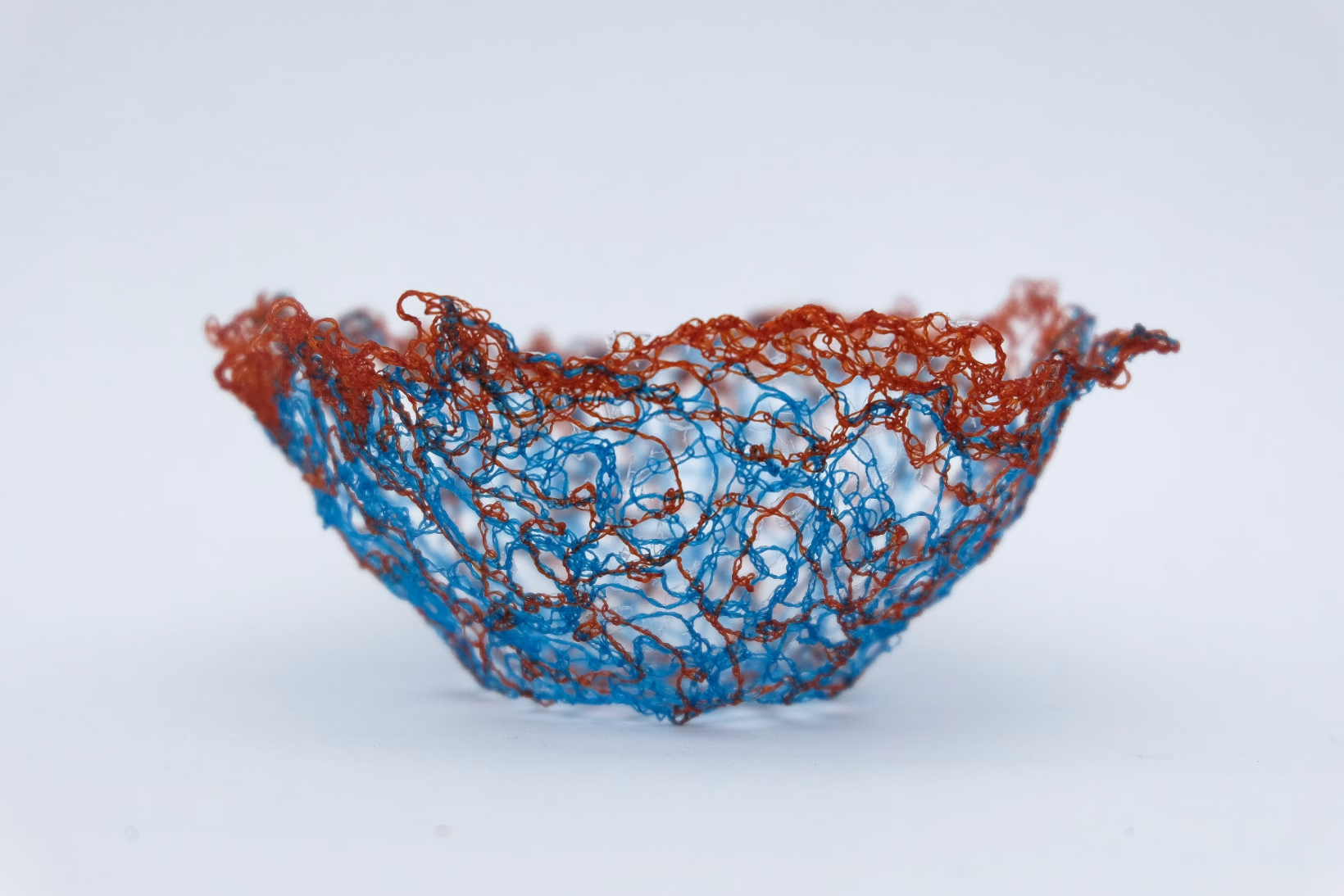 Red and blue thread bowl created with water-soluble fabric