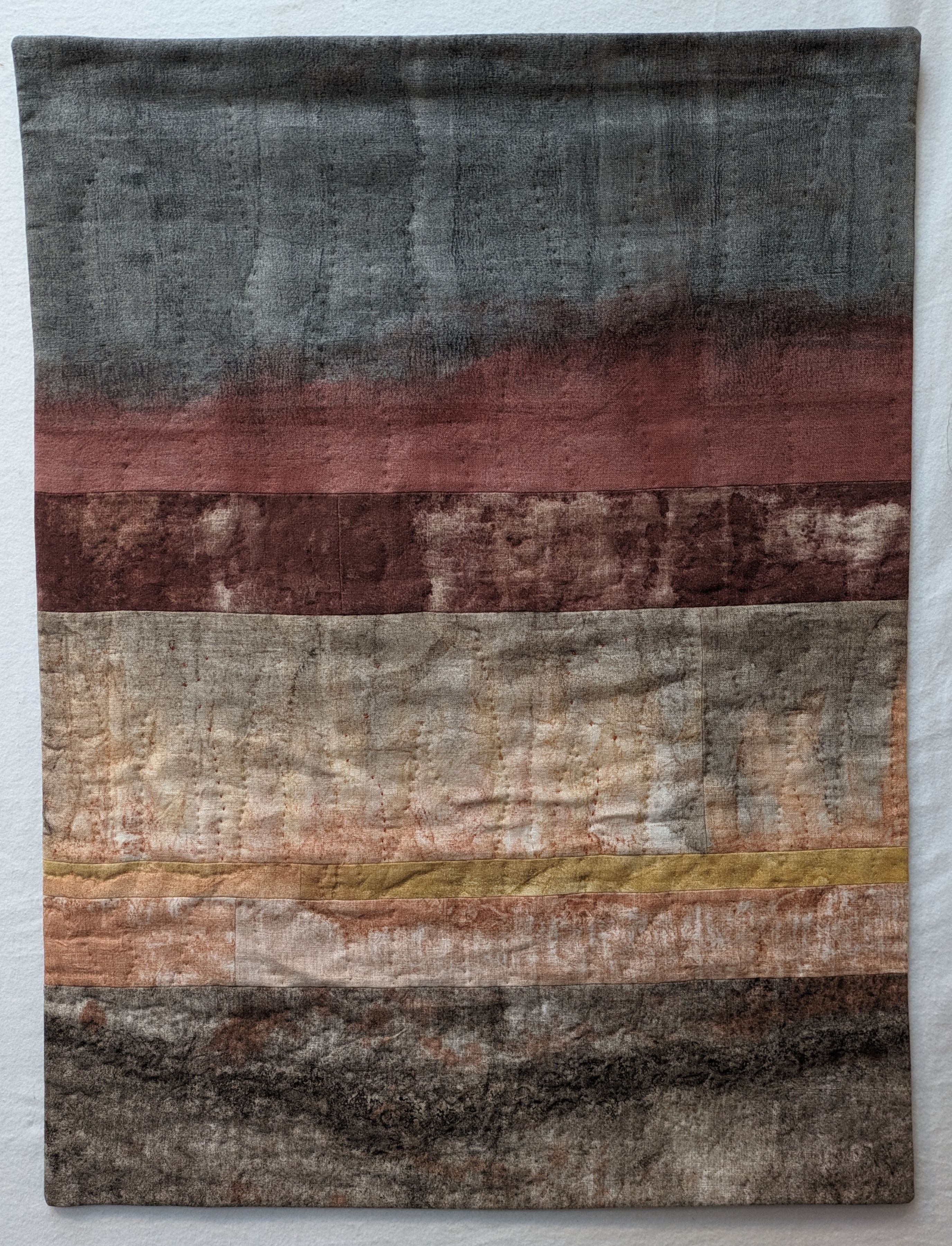 Wildfire and Mangrove textile artwork with gray, red, and brown tones